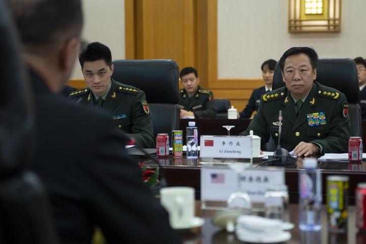 General Li Zuocheng of China's Central Military Commission sits with Chinese military officers at a Beijing meeting in January 2019.