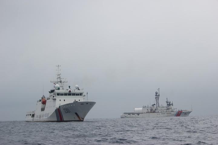 China Coast Guard patrol vessel 2301 alongside the U.S. Coast Guard cutter Alex Haley during a 2018 fisheries-enforcement handover in the Sea of Japan.